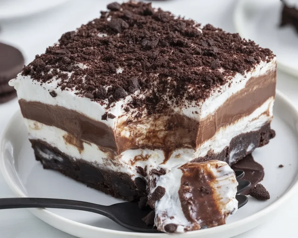 Delicious OREO Lasagna with creamy layers of cheesecake and chocolate pudding