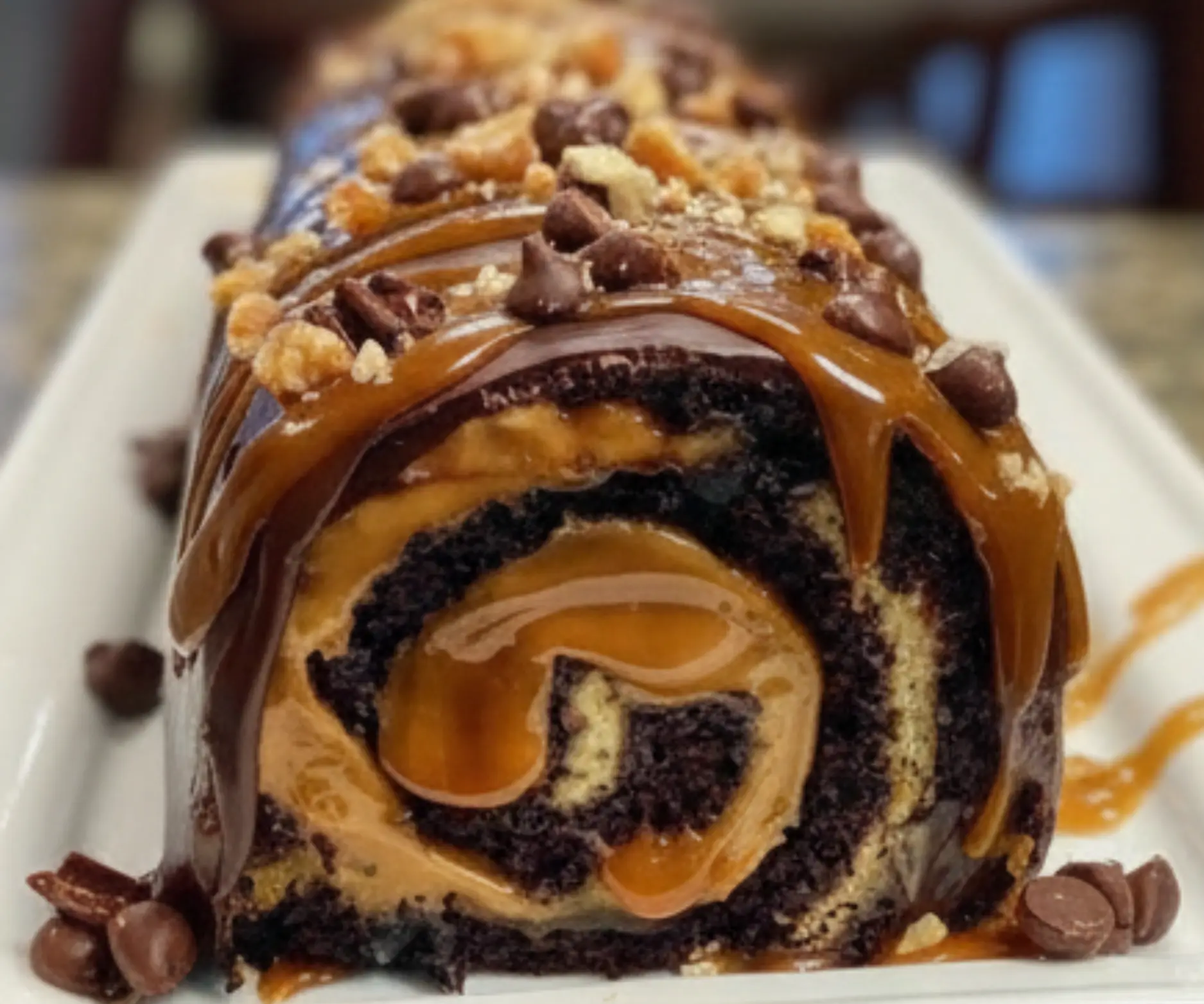 Gooey Chocolate Caramel Turtle Cake Roll