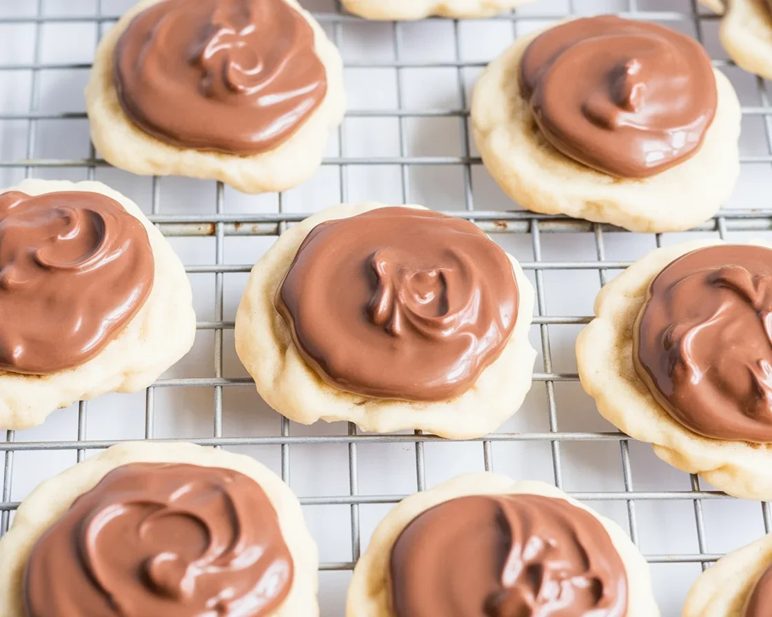 Delicious Twix cookies with buttery shortbread, caramel, and chocolate topping.